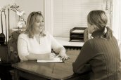 Erin reviews needs with a Rolfing client