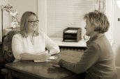 Erin reviews needs with a Rolfing client