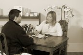 Erin reviews needs with a Rolfing client